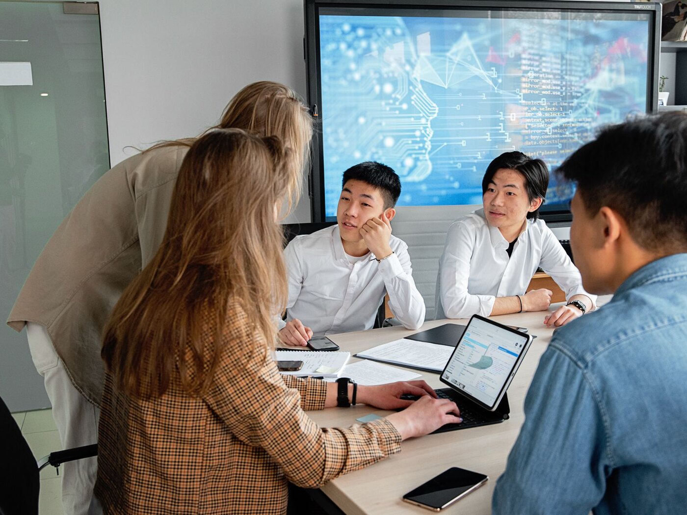 Technology professionals collaborating on a digital initiative